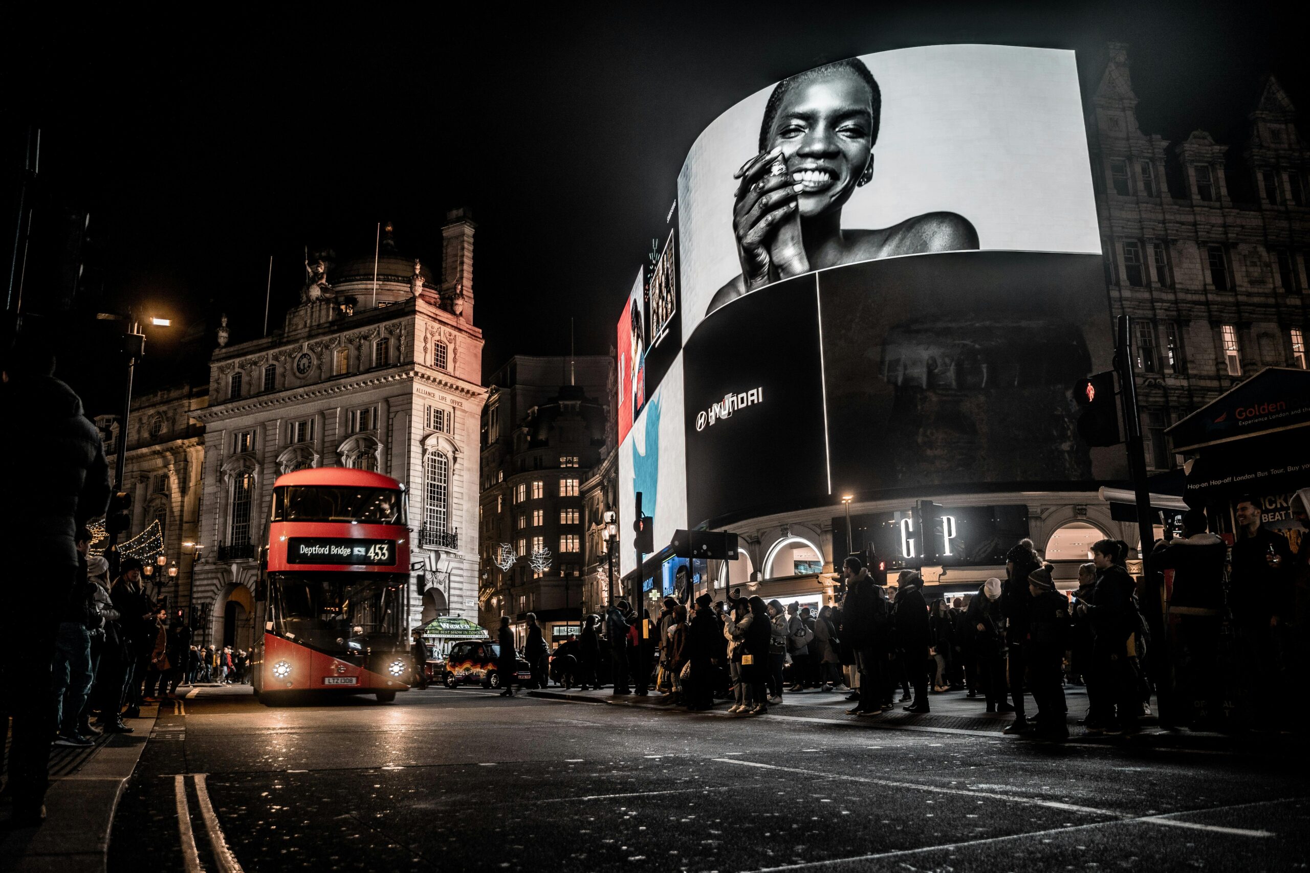 pexels-photo-3220846-3220846 Vibrant city life at night in Piccadilly Circus, London with double-decker bus and illuminated billboards.